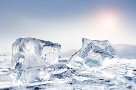 Beautiful blue icicles. Winter landscape with ice on the lake. Small depth of sharpness. Creative toning effectの写真素材