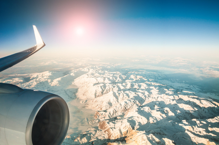 Mountain view from an airplane window. Travel holiday backgroundの写真素材