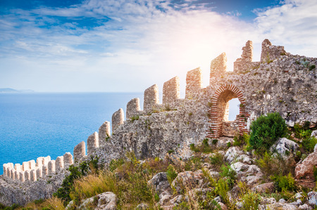 The wall of an ancient fortress on the hill in Alanya, Turkey. Beautiful summer landscapeの写真素材