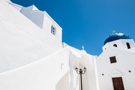 The Church in the town of Imerovigli. White architecture on Santorini island, Greeceの写真素材