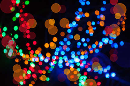 Christmas shiny background with colorful lightsの写真素材