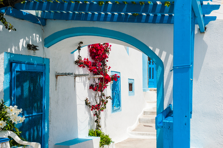 White and blue architecture on Santorini island, Greece. Beautiful narrow street in Firaの写真素材