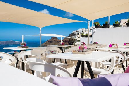 Cafe on the terrace with a beautiful sea view. Santorini, Greeceのeditorial素材