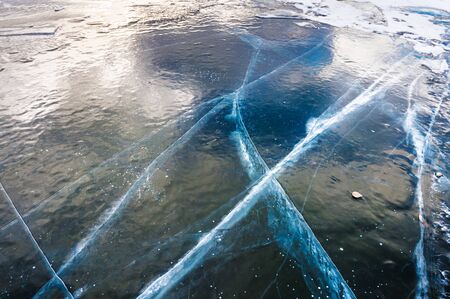 Natural blue ice on the lake. Beautiful winter backgroundの写真素材