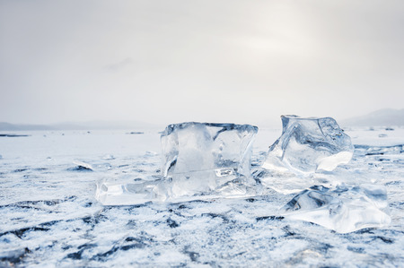 Ice on the frozen lake. Beautiful winter landscape. Small depth of field
