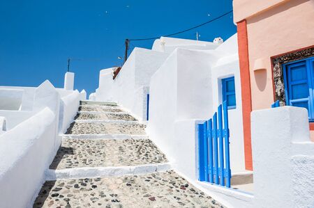 Street in Fira town. White architecture on Santorini island, Greece. Beautiful summer landscape