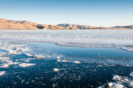 Beautiful winter landscape with ice and snow on the lakeの写真素材