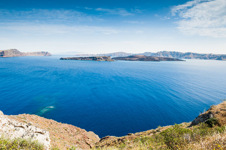 Beautiful views of the sea and Islands. Summer landscape. Santorini island, Greece.の写真素材