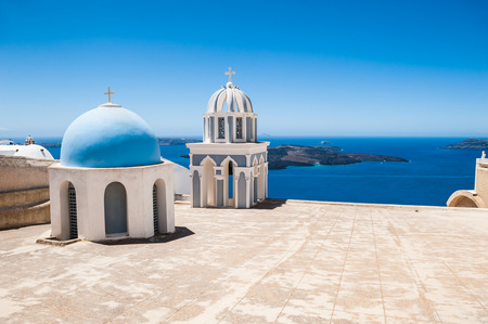 The Church in Imerovigli village. White architecture on Santorini island, Greece. Beautiful view on the seaの写真素材