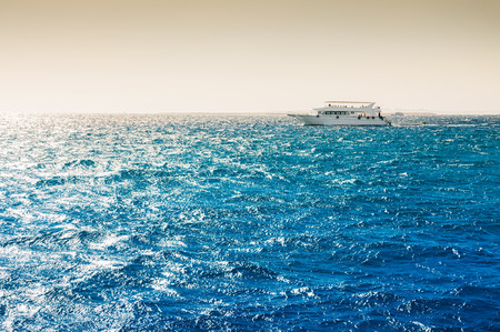 White yacht in the Red sea at sunset. Beautiful summer seascapeの写真素材