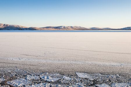 Beautiful winter landscape with ice and snow on the lakeの写真素材