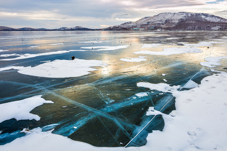 Beautiful ice on the lake at sunset. Winter landscapeの写真素材