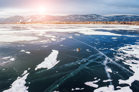 Beautiful ice on the lake at sunset. Winter landscapeの写真素材