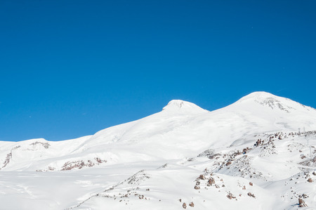 Mount Elbrus, the highest peak of Europe. Ski resort. Caucasus, Russian Federation. Winter mountains. Beautiful winter landscapeの写真素材