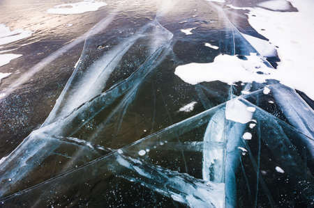 Natural ice on the lake. Beautiful winter landscape. Small depth of sharpnessの写真素材