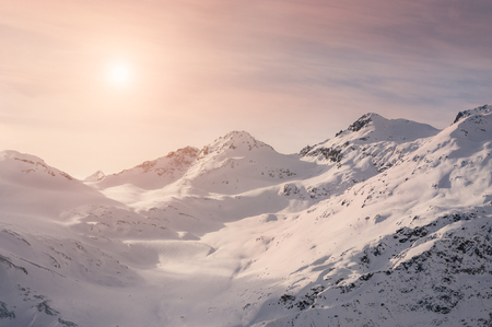 Winter mountains at sunset. Beautiful winter landscape. Creative toning effectの写真素材