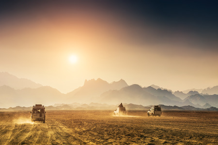 Car travel in the desert. Beautiful mountains in the Arabian desert at sunset.の写真素材