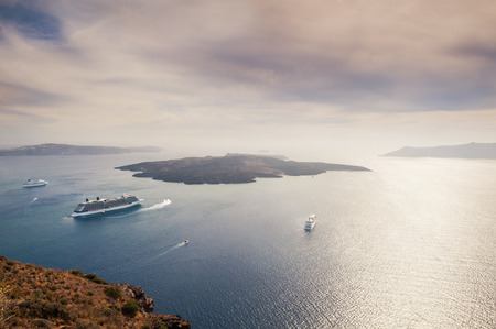 Beautiful view of the sea and islands at sunset. Santorini island, Greece. Retro effectの写真素材