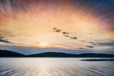 Fantastic sunset on the lake. Beautiful summer landscape.の写真素材