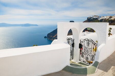 White architecture on Santorini island, Greece. Beautiful landscape with sea view at sunset.の写真素材