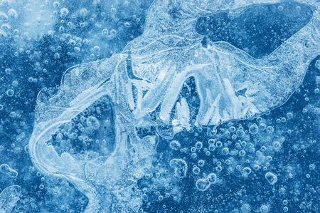 Macro image of ice with air bubbles. Ice background. Small depth of fieldの写真素材