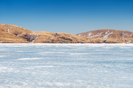 Beautiful landscape with ice and snow on the lake. Small depth of field. Small depth of fieldの写真素材