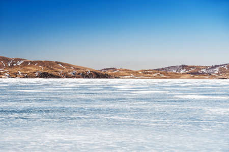 Beautiful landscape with ice and snow on the lake. Small depth of fieldの写真素材