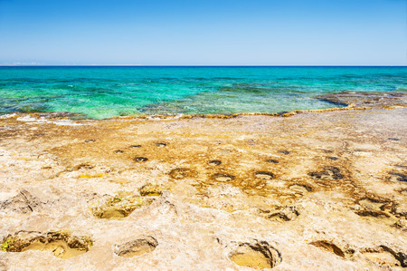 Beautiful wild beach with clear turquoise water and rocks. Malia, Crete island, Greece. Selective focusの写真素材