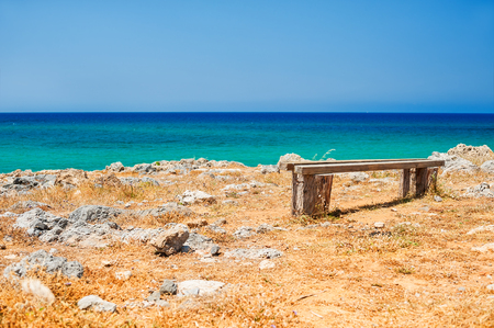 Beautiful wild beach with turquoise water and rocks. Place for relax. Malia, Crete island, Greece. Selective focusの写真素材