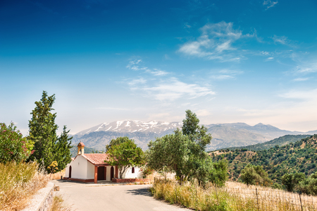 Chapel in the mountains on the Crete island, Greece. Beautiful summer landscape.の写真素材