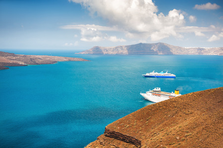 Beautiful landscape with sea view. Cruise liners at the sea. Santorini island, Greece.の写真素材