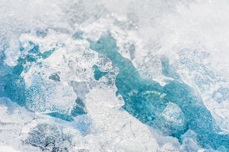 Blue ice on the frozen lake. Macro image with small depth of fieldの写真素材