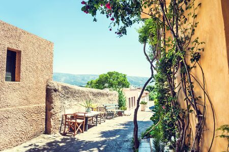 Beautiful street in Athens, Greece. National architecture in the ancient district of Plaka. Vintage effectの写真素材