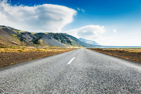 Icelandic road with mountain view. Beautiful summer landscape, southern Iceland.の写真素材