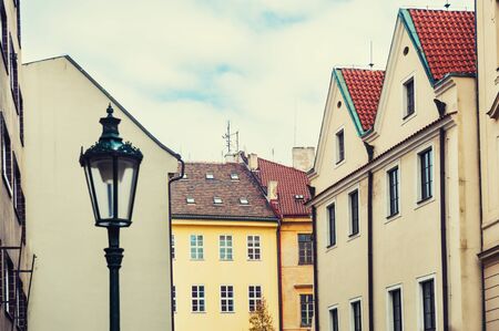 Houses with tiled roofs in old town. Prague, Czech Republic. Vintage filter, retro effectの写真素材