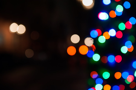 Blurred shiny background with colorful lights and bokeh