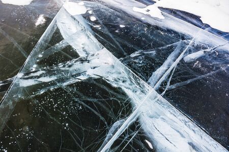 Natural ice on the frozen lake. Beautiful winter background.の写真素材