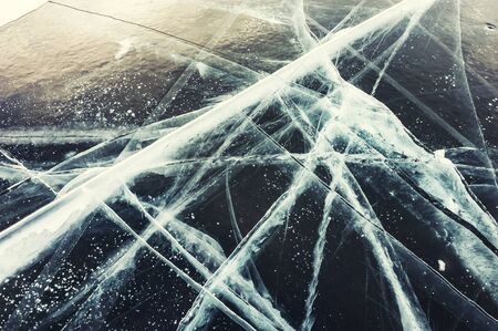 Cracked ice on the lake.の写真素材