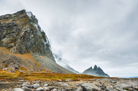 Beautiful mountains and fog on the coast of the Atlantic ocean in Stokksnes, East Icelandの写真素材