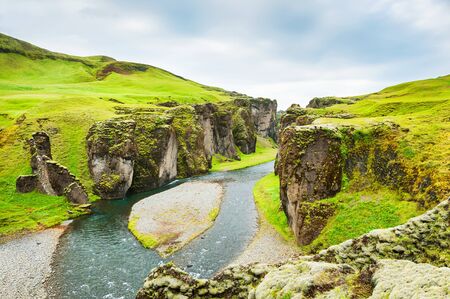 Fjadrargljufur canyon with river and big rocks. South Icelandの写真素材