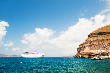Beautiful view of the sea and islands. Cruise liner near Santorini island, Greece.の写真素材