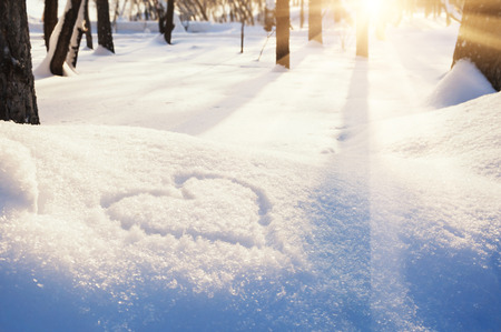 Shape of heart on the snow. Winter landscapeの写真素材