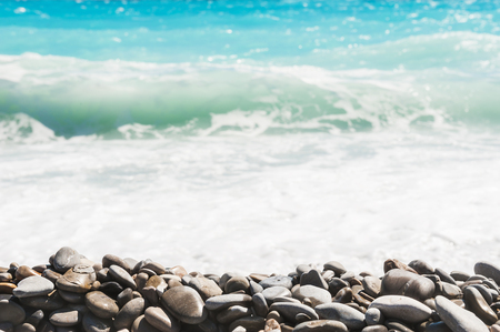 Beach with turquoise water and pebbles. Blurred sea backgroundの写真素材