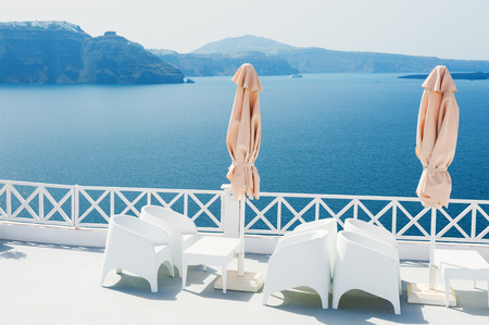White architecture on Santorini island, Greece. Beautiful terrace with sea viewの写真素材