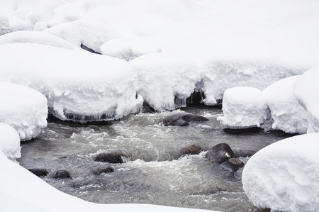 Snowfall on the river. Beautiful winter landscape.の写真素材