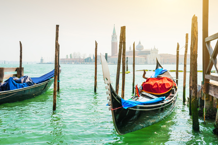 Gondolas on Grand canal in Venice, Italy. Beautiful landscape at sunriseの写真素材