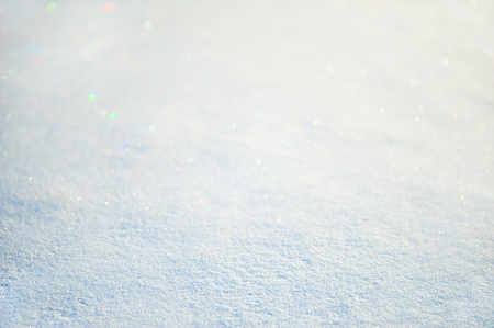 Blurred winter snow background. Macro image of snow, selective focus, bokeh effect.の写真素材