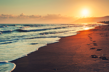 Beautiful sea coast at sunrise. Vintage filterの写真素材