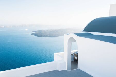 White architecture on Santorini island, Greece. Beautiful landscape at sunset, sea view.の写真素材