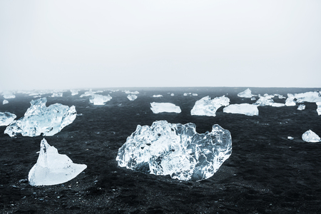 Ice on the black volcanic sand. Jokulsarlon ice beach, south Icelandの写真素材